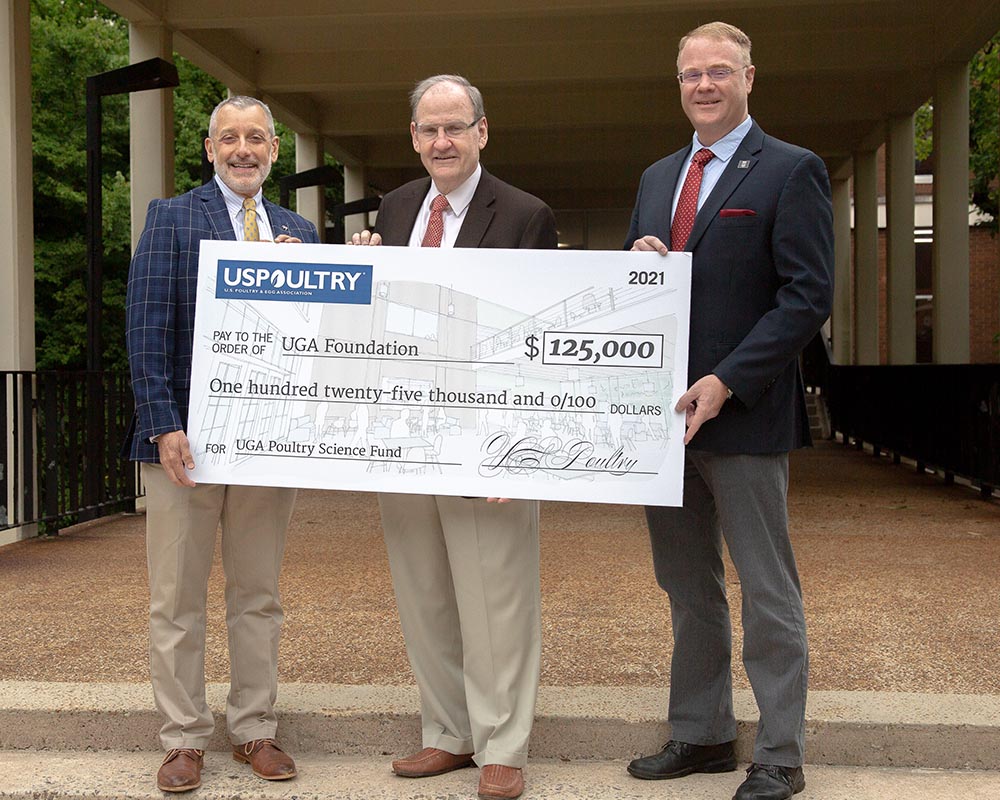 CAES Dean Nick Place, Department of Poultry Science Head Todd Applegate, and USPOULTRY President John Starkey