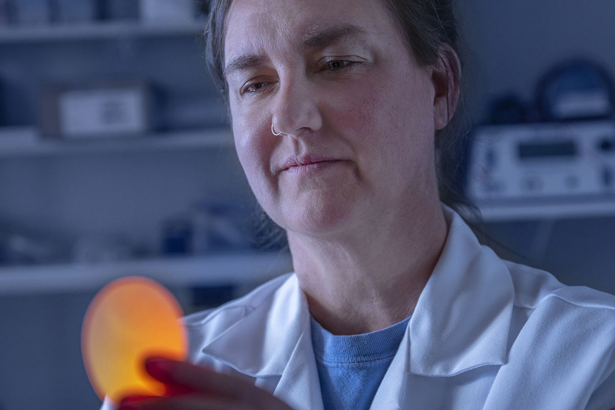 Laura Ellestad candling an egg